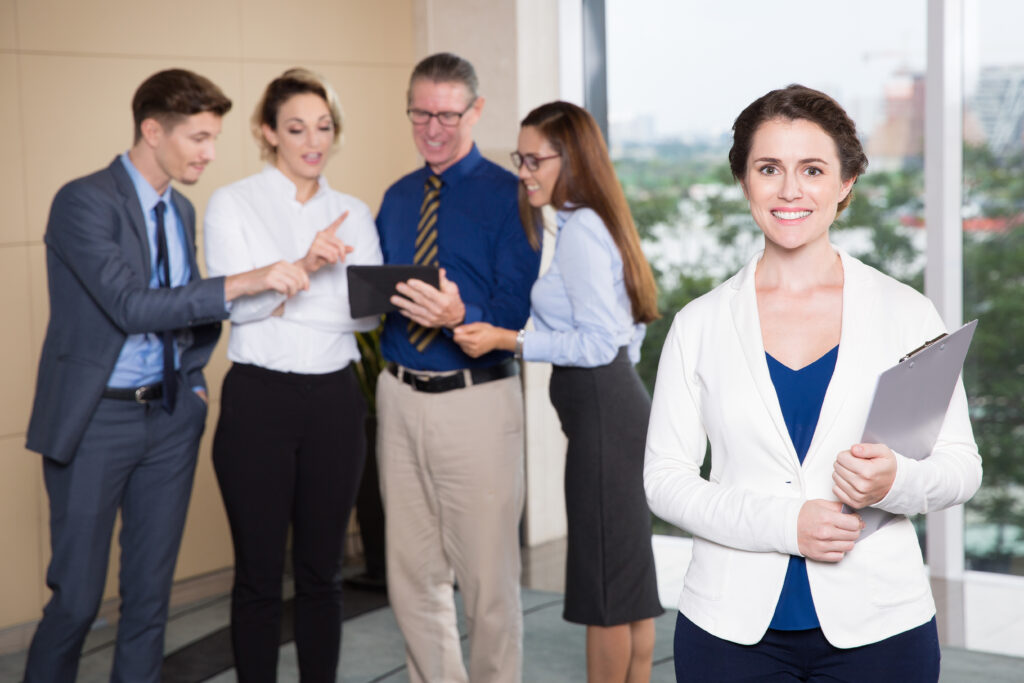 Smiling Female Executive Standing Front Team 1024x683